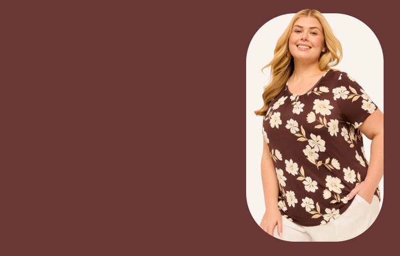 A smiling woman in a floral top stands against a cream-colored oval on a maroon background.