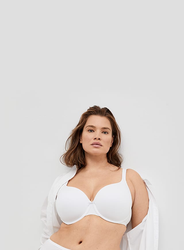 woman in white Lane Bryant Cacique bra