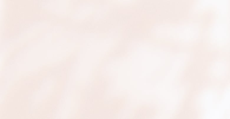 A soft, pale pink textured background with subtle, blurred white highlights.