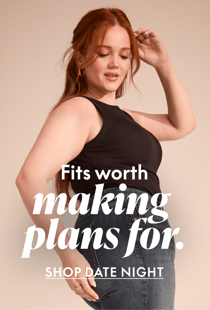 A woman with red hair in a black tank top and jeans poses against a plain background with text overlay.