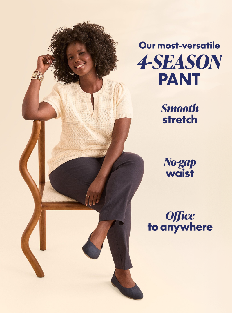 A smiling Black woman in a cream sweater and dark pants sits on a wooden chair against a plain, light background, with text highlighting the '4-SEASON PANT.' Our most versatile 4-season pant: Smooth stretch, No-gap waist, office to anywhere
