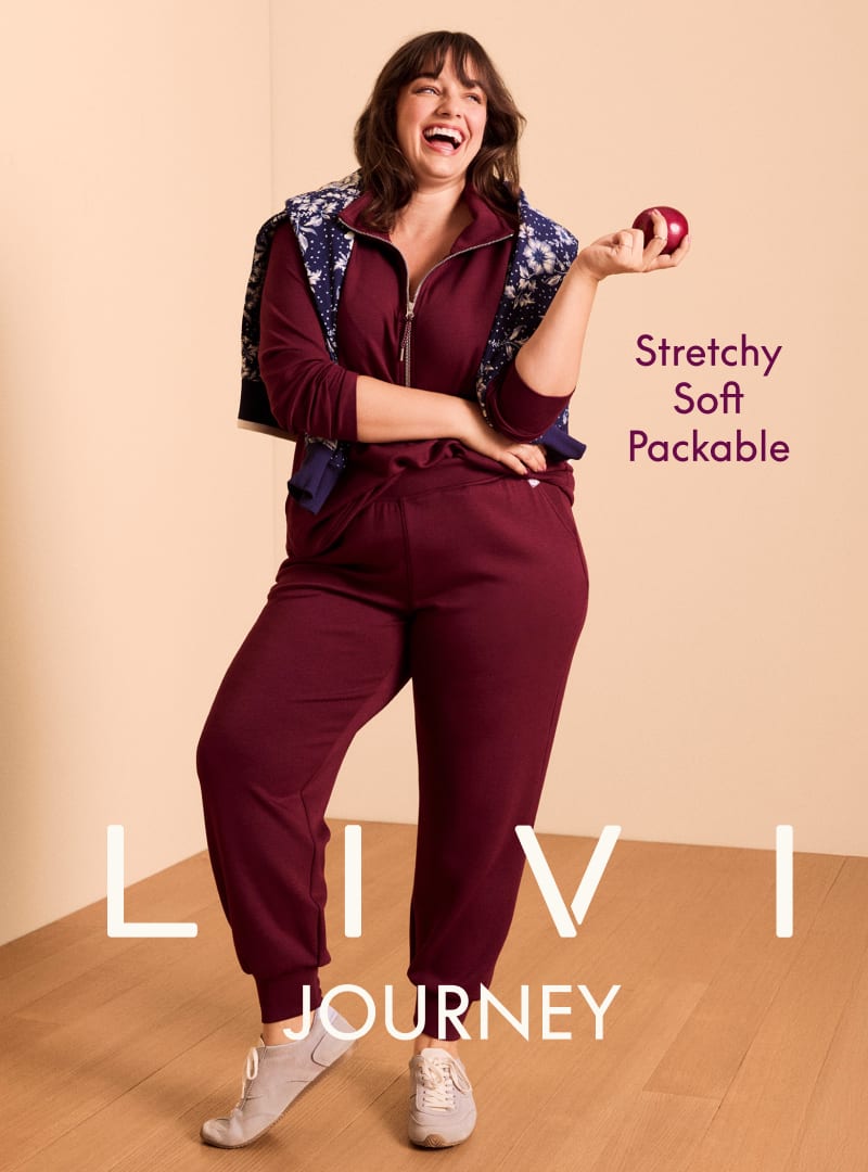 A smiling woman in maroon loungewear stands in the foreground against a plain, light-colored wall with the brand name 'LIVI JOURNEY' displayed.