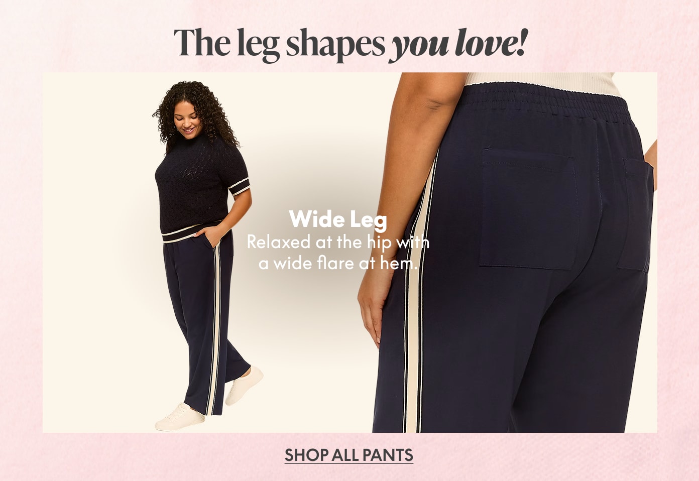 A woman models navy blue wide-leg pants with a white stripe down the side, set against a soft pink background.