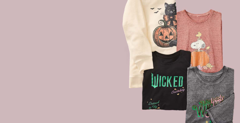 Four Halloween-themed t-shirts are neatly stacked on a plain red background with a circular '100s more choices' graphic in the upper right corner.