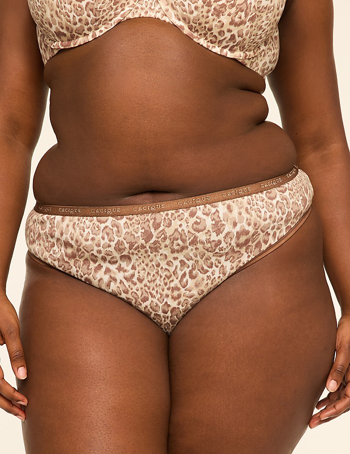 A person in leopard-print underwear stands against a plain background.
