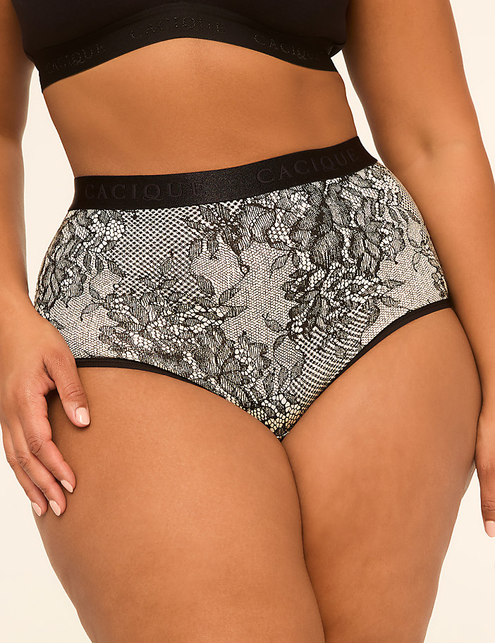 A woman's torso is shown from the waist down, wearing high-waisted lace panties with a floral pattern, against a plain, light-colored background.