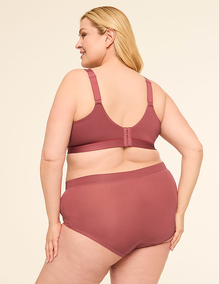 A woman in a mauve bra and matching underwear is shown from the back against a plain, light background.