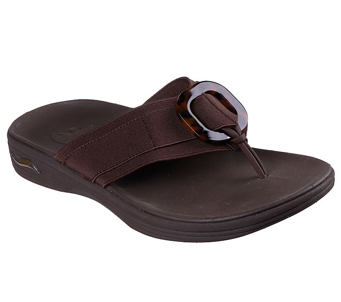 A brown flip-flop sandal with a tortoiseshell buckle sits on a white background.