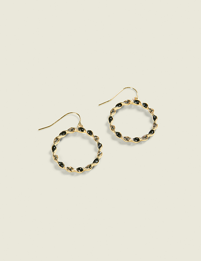 A pair of gold hoop earrings with black stones are displayed against a plain, light-colored background.