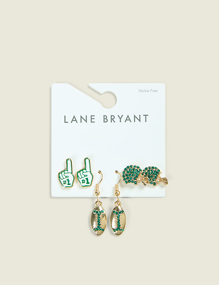 A white card from Lane Bryant displays three pairs of green and gold earrings, including foam fingers, football helmets, and oval-shaped earrings with the letter "I", against a pale green background.