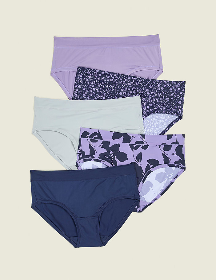 Five pairs of women's underwear, in solid colors and floral patterns, are neatly arranged against a plain, light beige background.