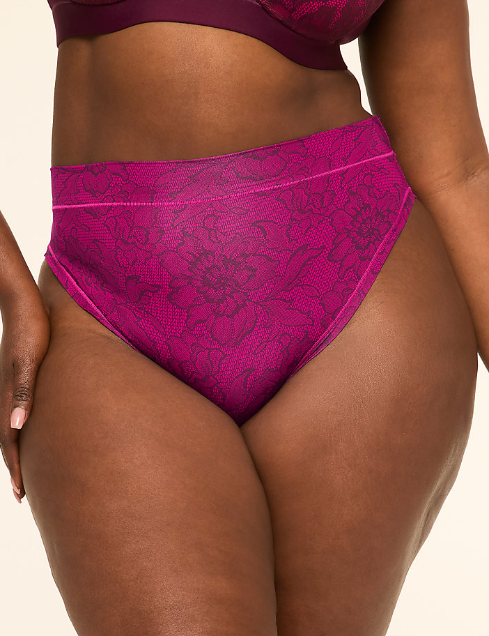A close-up of a woman's torso in magenta floral-patterned underwear and bra is set against a plain, light background.