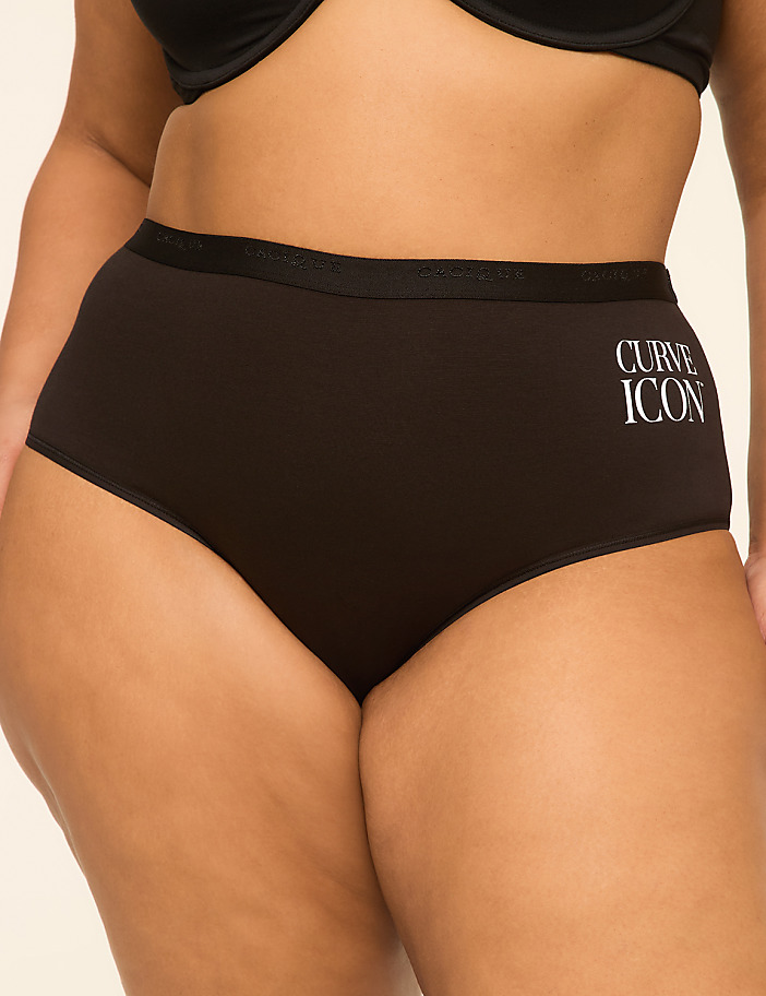 A person wears high-waisted black underwear with "CURVE ICON" printed on the side, against a plain background.