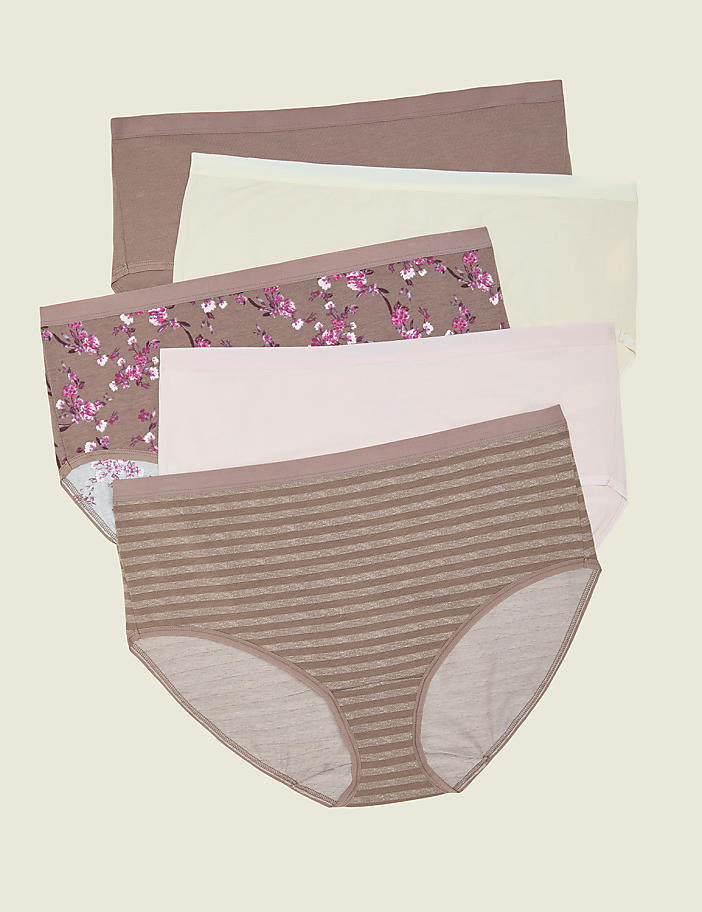 Five pairs of women's underwear, with varying patterns and colors, are neatly stacked against a plain, light-colored background.