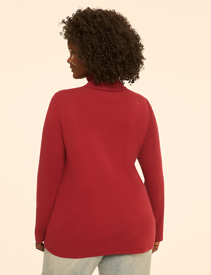A woman in a red turtleneck is shown from the back against a plain, light-colored background.