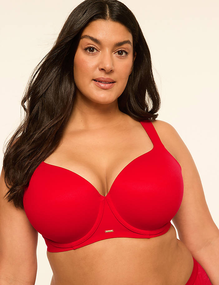 A woman with dark hair and a red bra is in the foreground, against a plain, light-colored background.