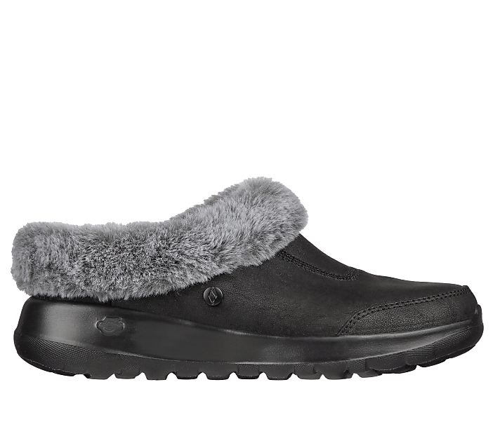 A black mule shoe with a grey fur lining rests on a white background.