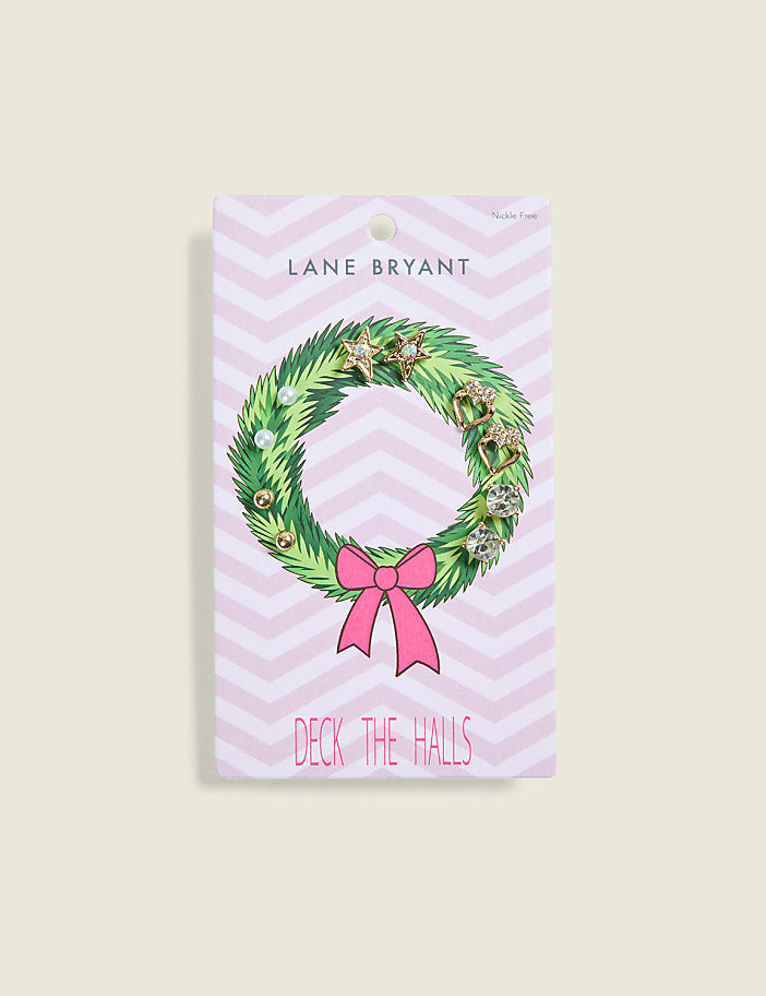 A set of gold and crystal stud earrings is displayed on a wreath-themed card with a pink chevron background.