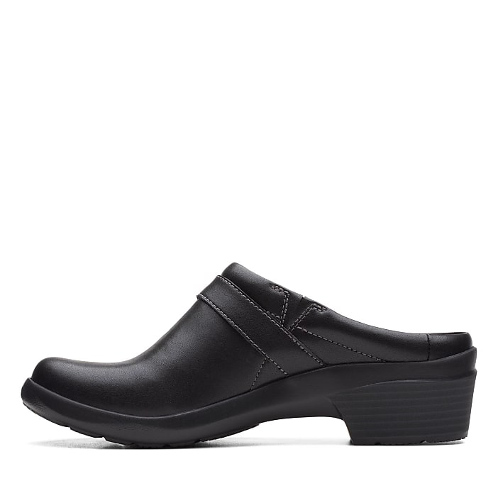 A single black leather clog sits in the foreground against a plain white background.