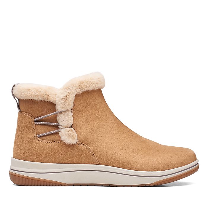 A tan faux-suede boot with a faux-fur collar sits centered against a plain white background.