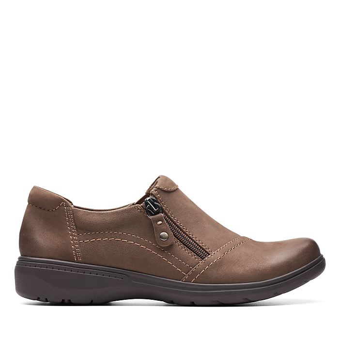 A brown leather slip-on shoe with a side zipper sits against a plain white background.