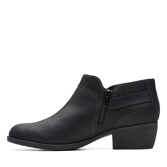 A single black leather ankle boot with a side zipper stands against a plain white background.