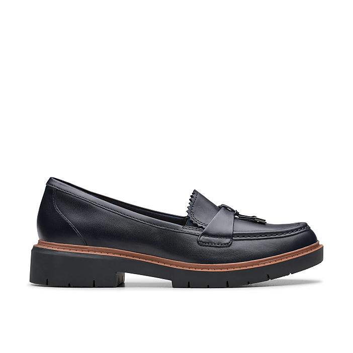 A single black leather loafer with a chunky sole sits against a plain white background.