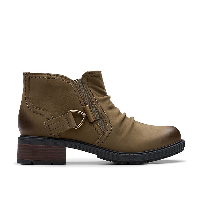 A brown leather ankle boot with a buckle detail sits centered against a plain white background.