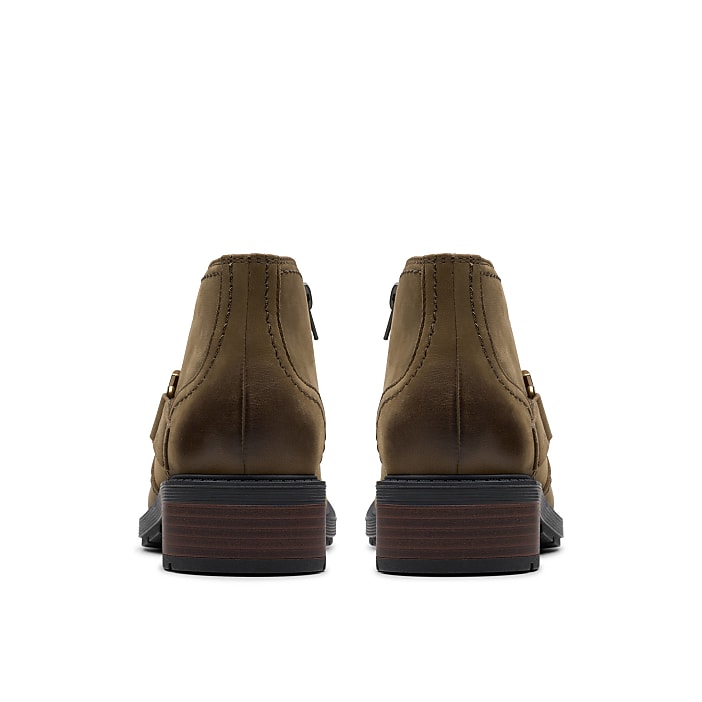 A pair of brown leather boots are positioned centrally against a plain white background.
