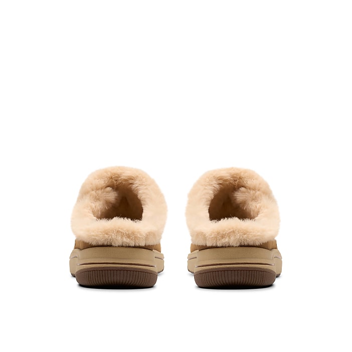 A pair of tan faux-fur slippers sits centered against a plain white background.