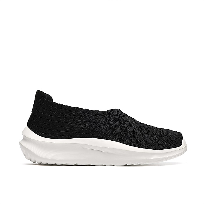A black woven slip-on sneaker with a thick white sole is centered against a plain white background.