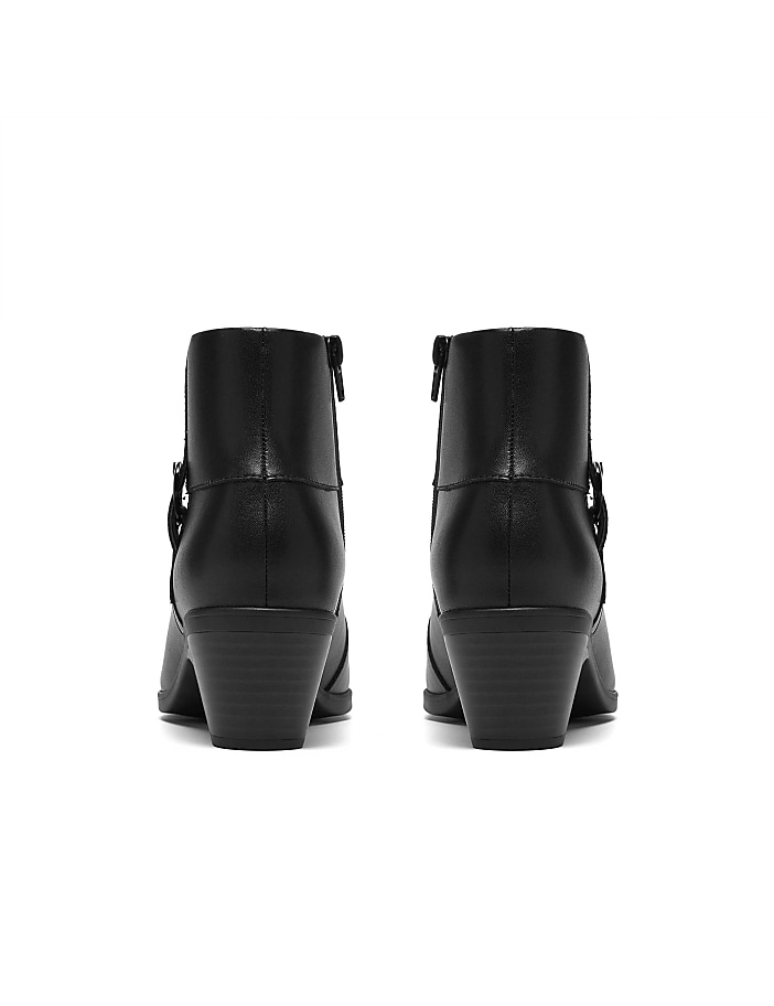 A pair of black heeled ankle boots are positioned side-by-side against a plain white background.