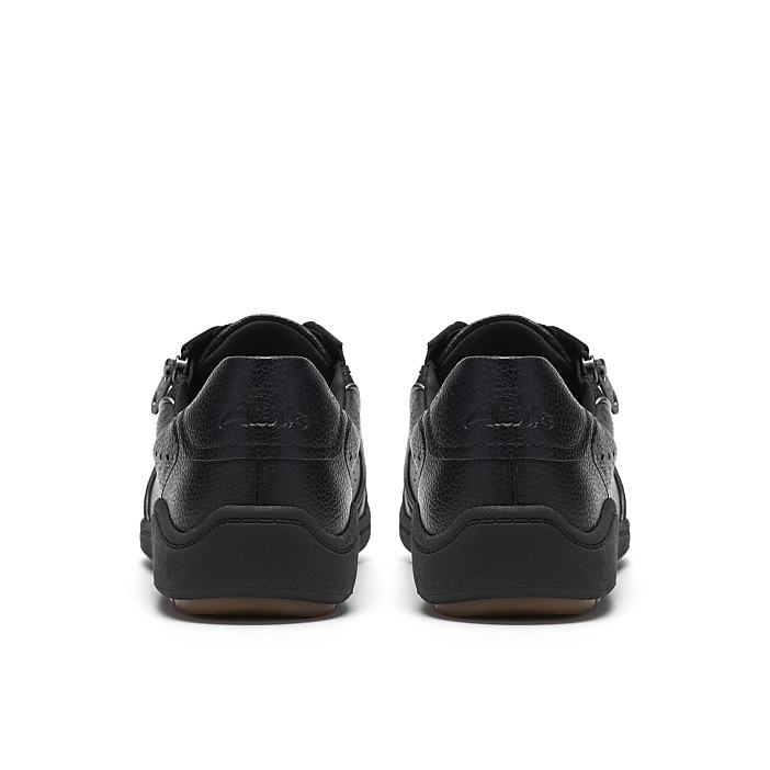 A pair of black leather shoes are positioned side-by-side against a plain white background.