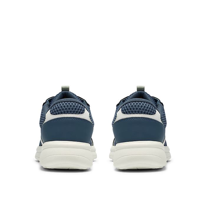 A pair of navy blue sneakers with white soles is positioned centrally against a plain white background.