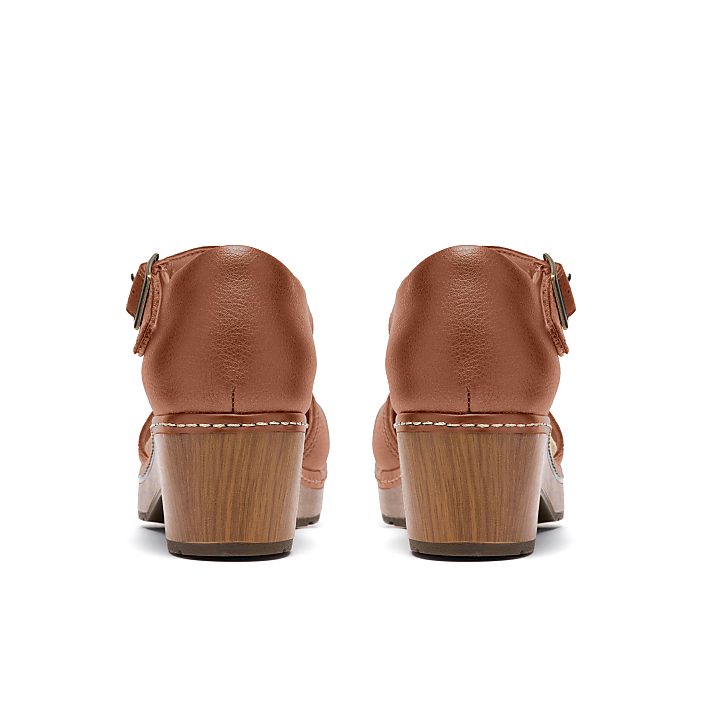 A pair of brown leather heeled sandals are positioned centrally against a plain white background.