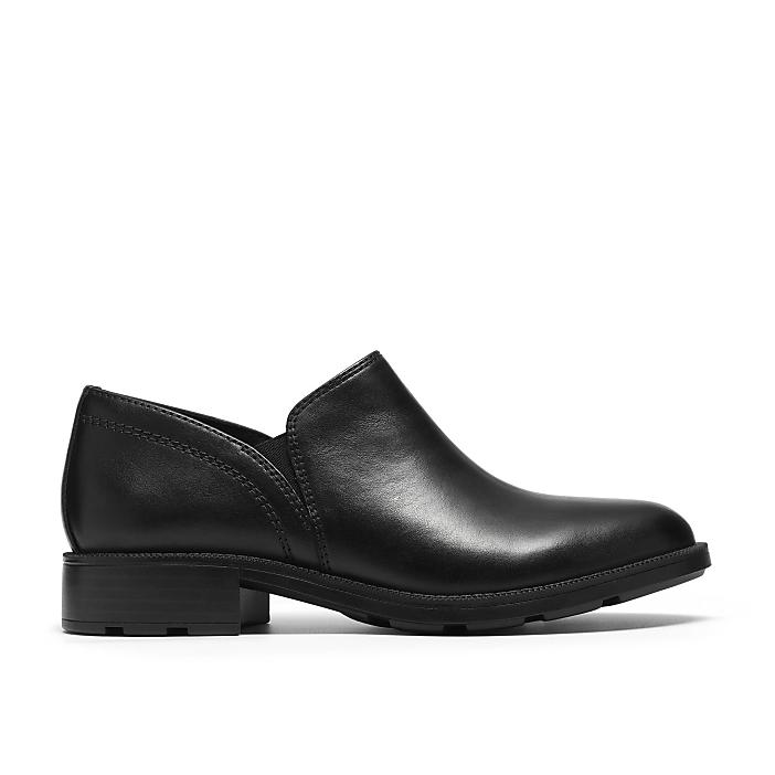 A single black leather slip-on shoe sits centered against a plain white background.
