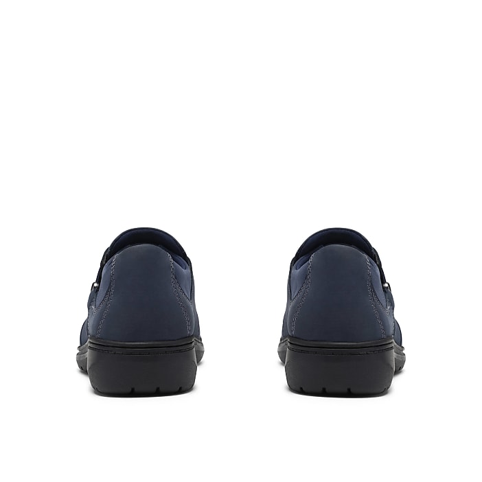 Two navy blue slip-on shoes are positioned side-by-side against a plain white background.