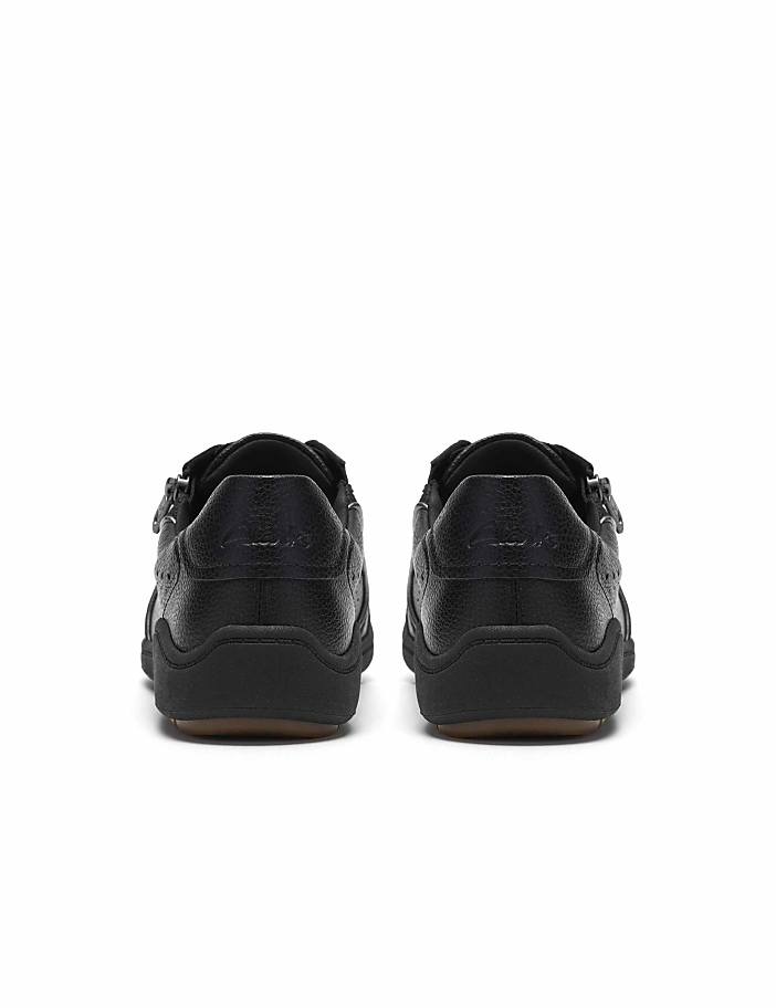 A pair of black leather shoes are positioned side-by-side against a plain white background.