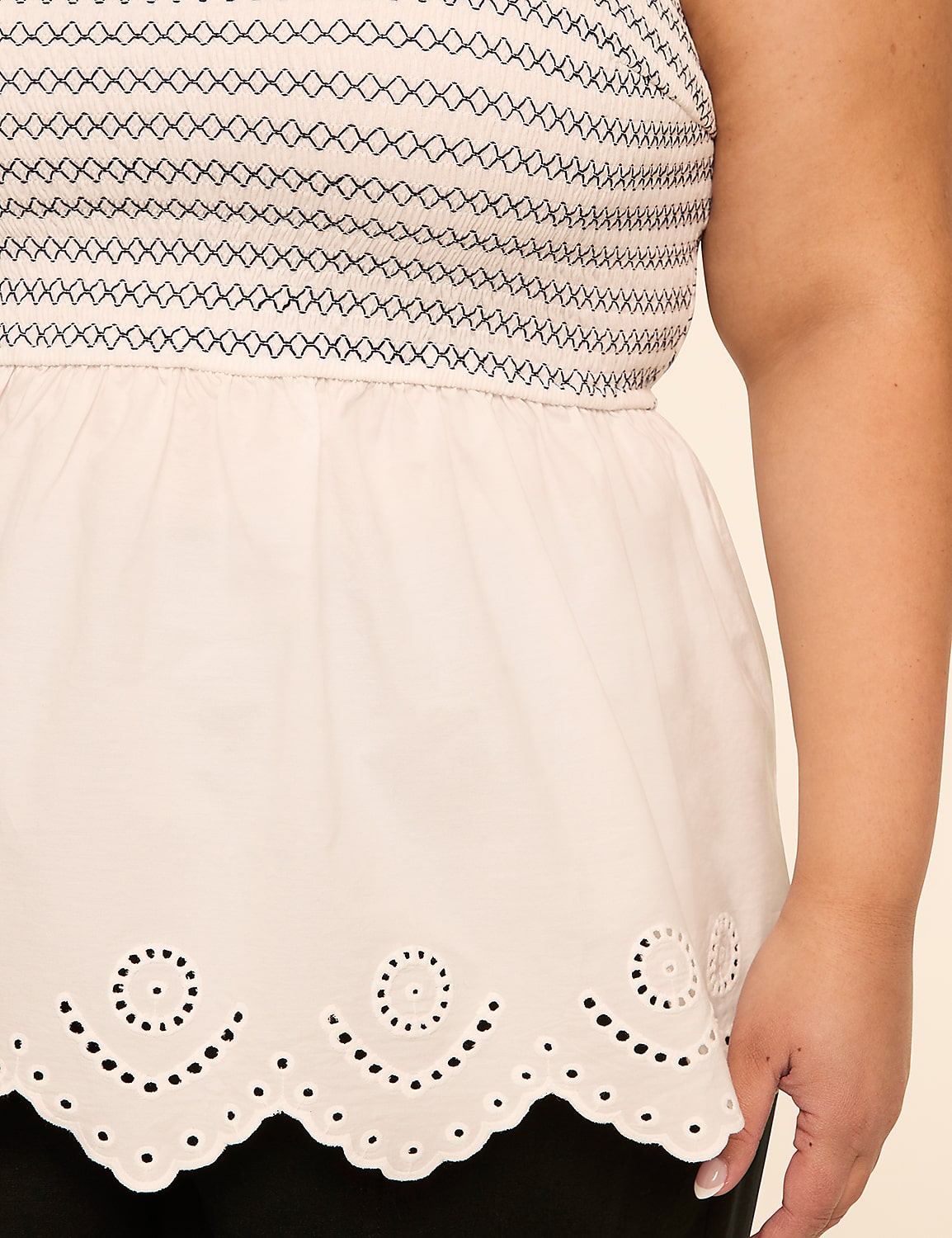 The image shows a close-up view of a person's midsection, revealing a patterned top and a white skirt with an embroidered scalloped hem. Product Image 4