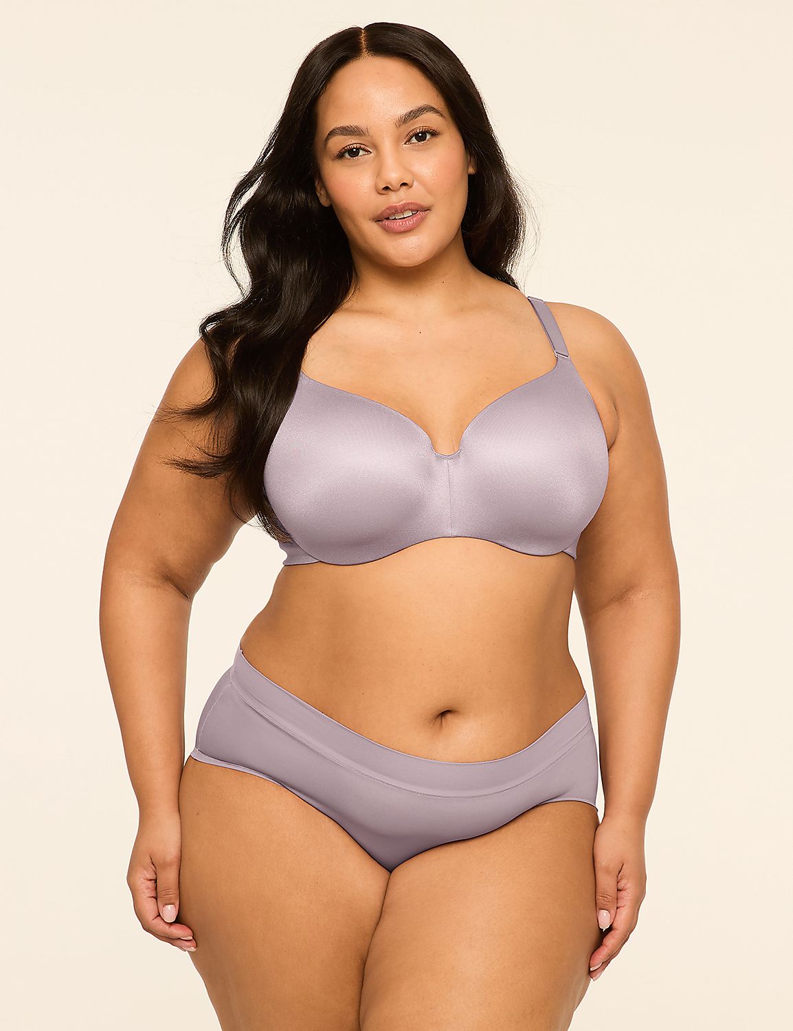 A woman in a lilac bra and underwear stands against a plain, light-colored background. Product Image 4