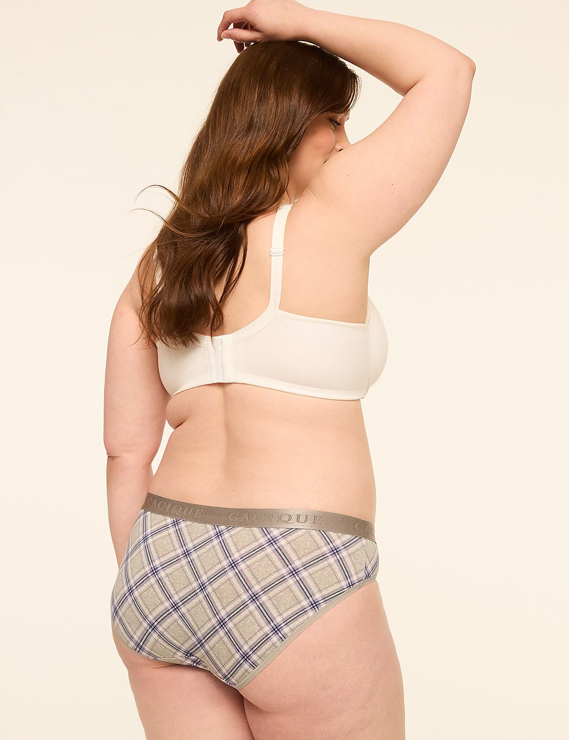 A woman in a white bra and plaid underwear stands with her arm raised against a plain, light-colored background. Product Image 2