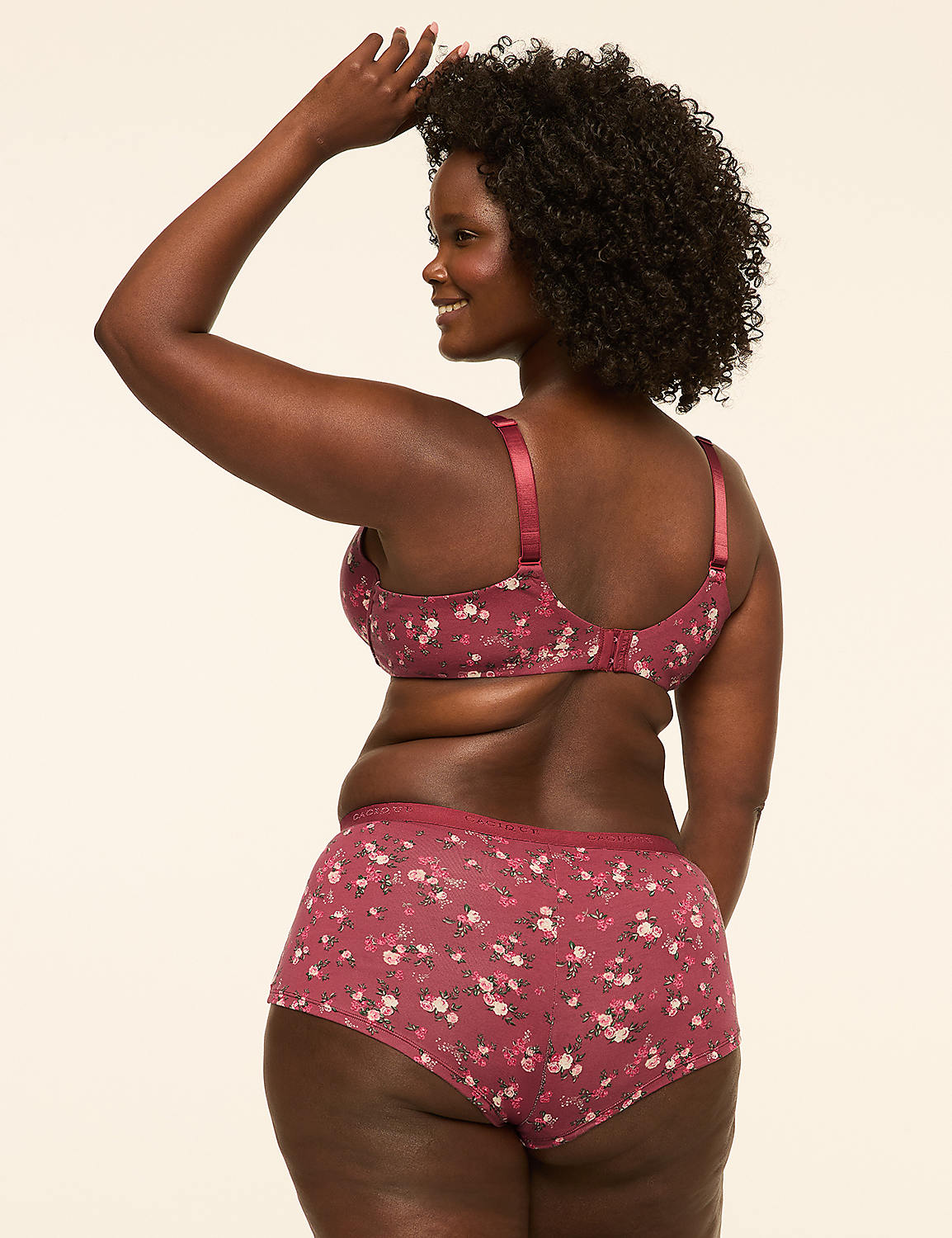 A woman in a floral bra and shorts stands against a plain, light-colored background. Product Image 2