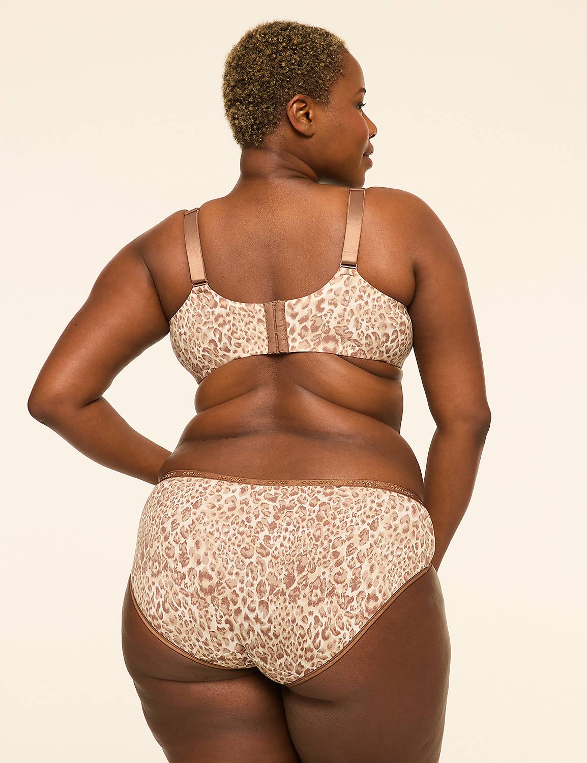 A woman with short, blonde hair is shown from behind, wearing a leopard-print bra and underwear against a plain, light-colored background. Product Image 2