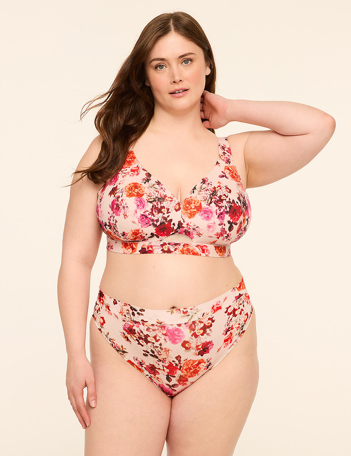A woman in a floral bra and underwear stands against a plain, light-colored background. Product Image 4