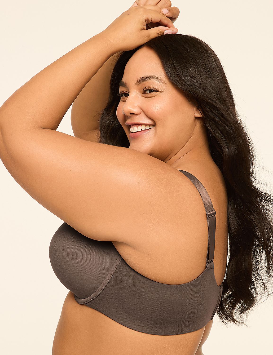 A smiling woman with dark hair, wearing a grey bra, poses against a plain, light-colored background. Product Image 3