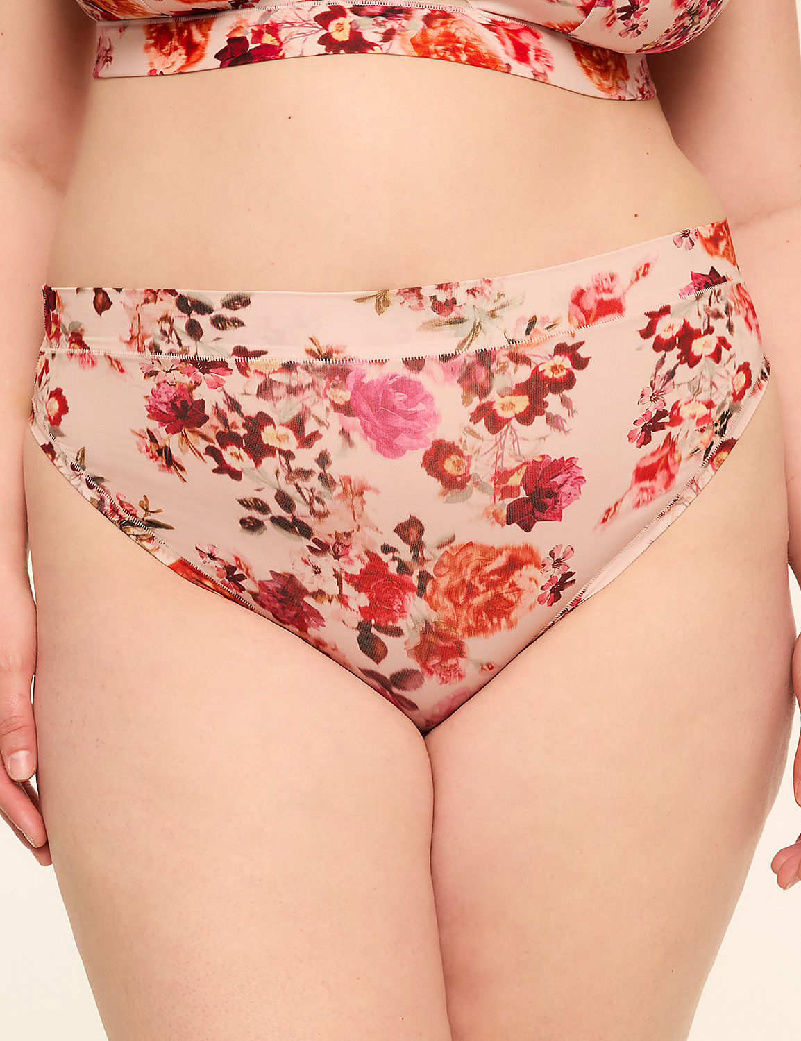 A close-up of a person wearing floral-patterned underwear with a plain background. Product Image 1