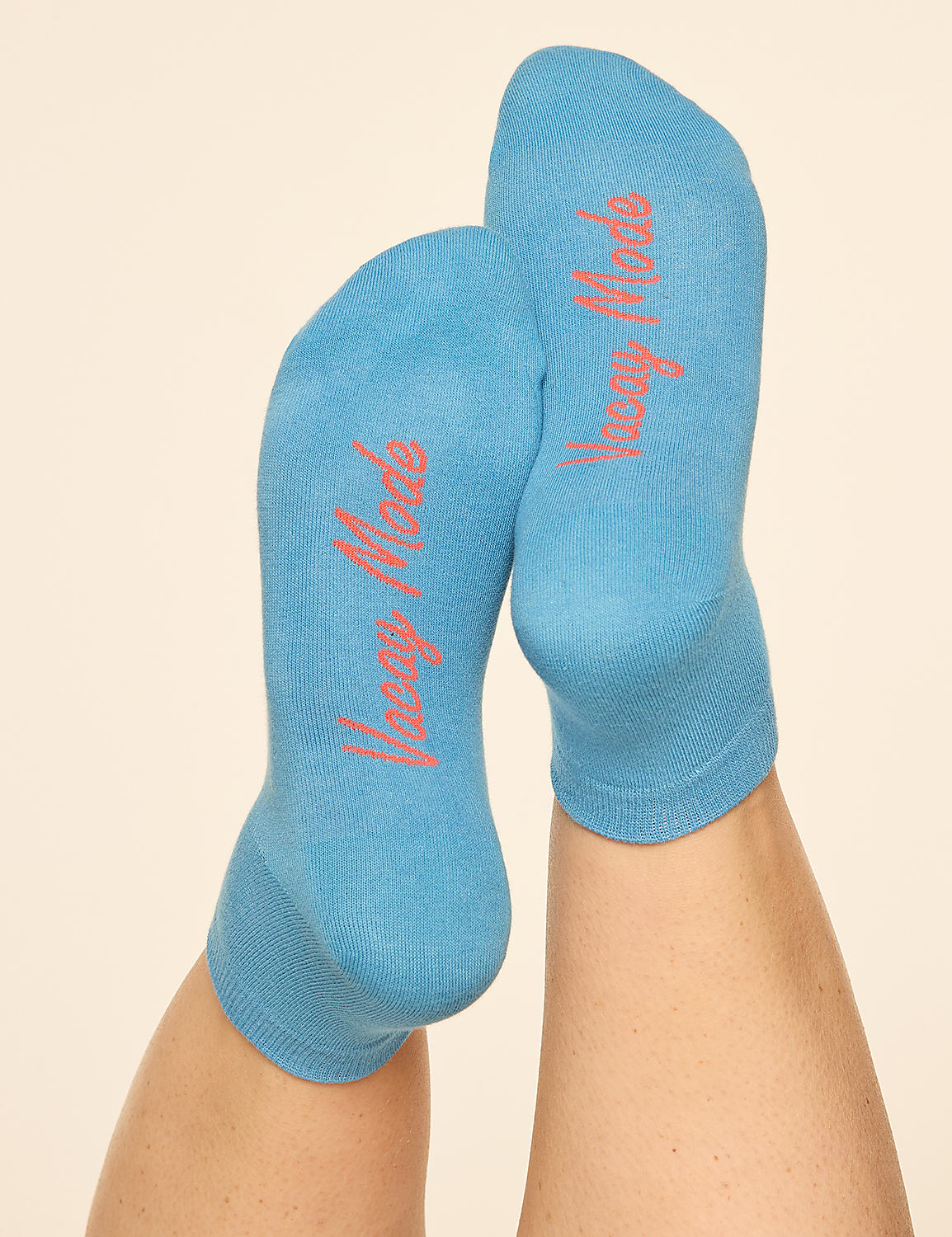 Two blue socks with "Vamp Mode" written in pink are on a person's feet, with a plain, light-colored background. Product Image 2