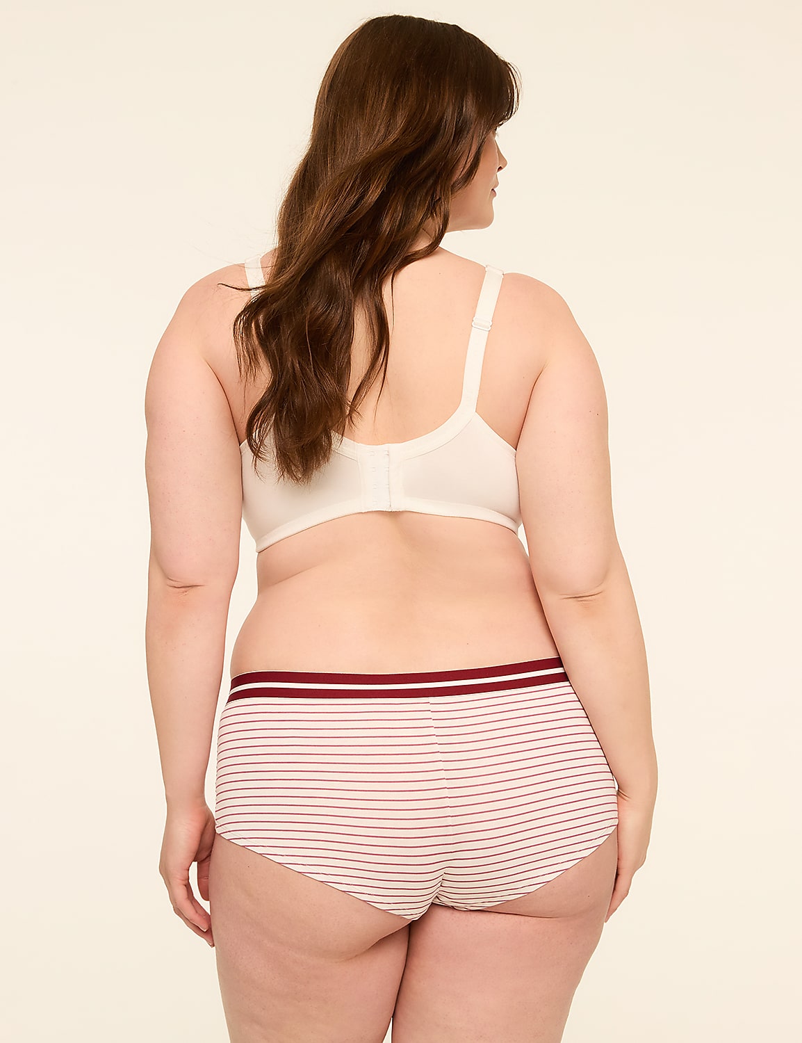 A woman in a white bra and striped underwear stands against a plain, light background. Product Image 2