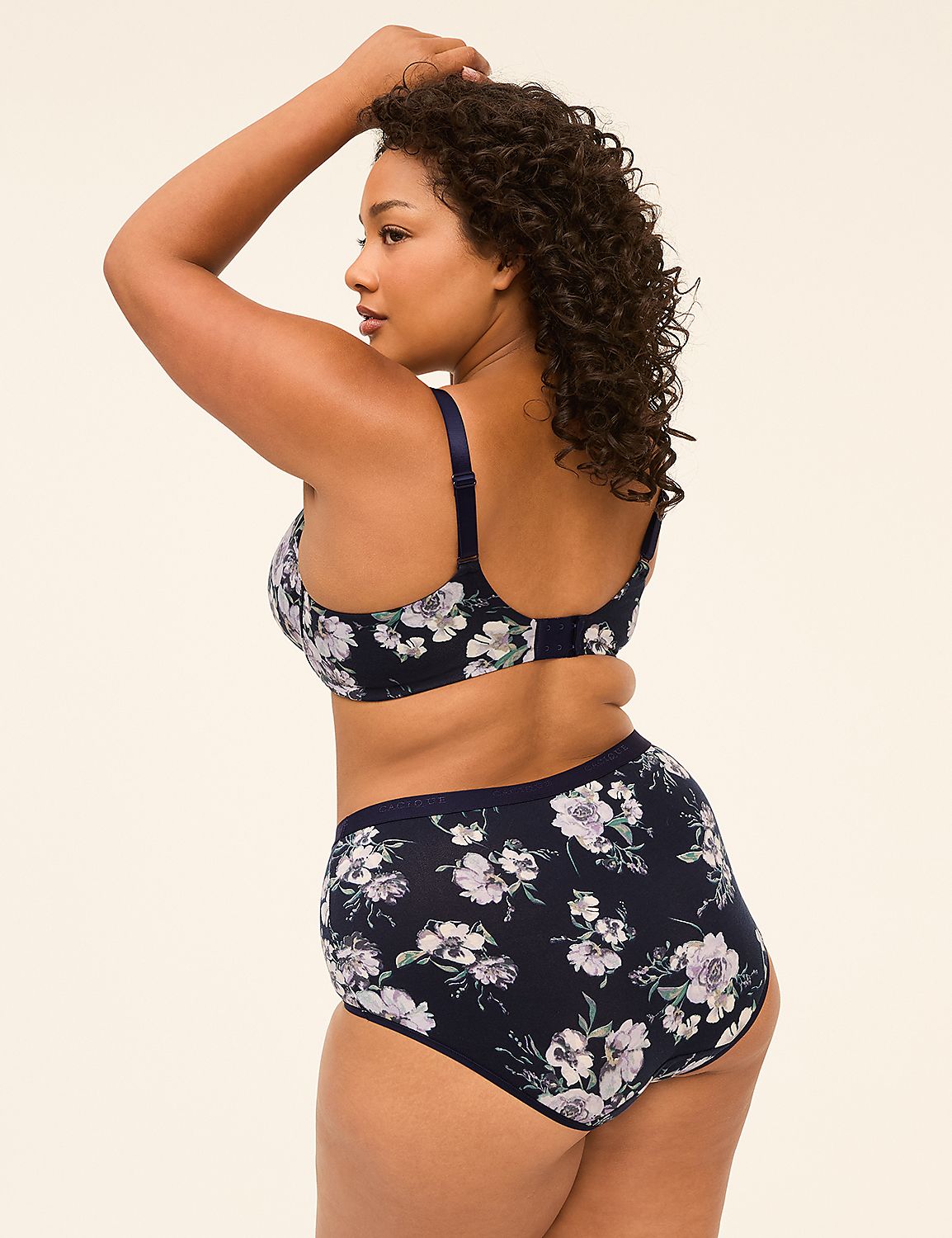 A woman in a floral bra and high-waisted underwear stands against a plain, light-colored background. Product Image 2