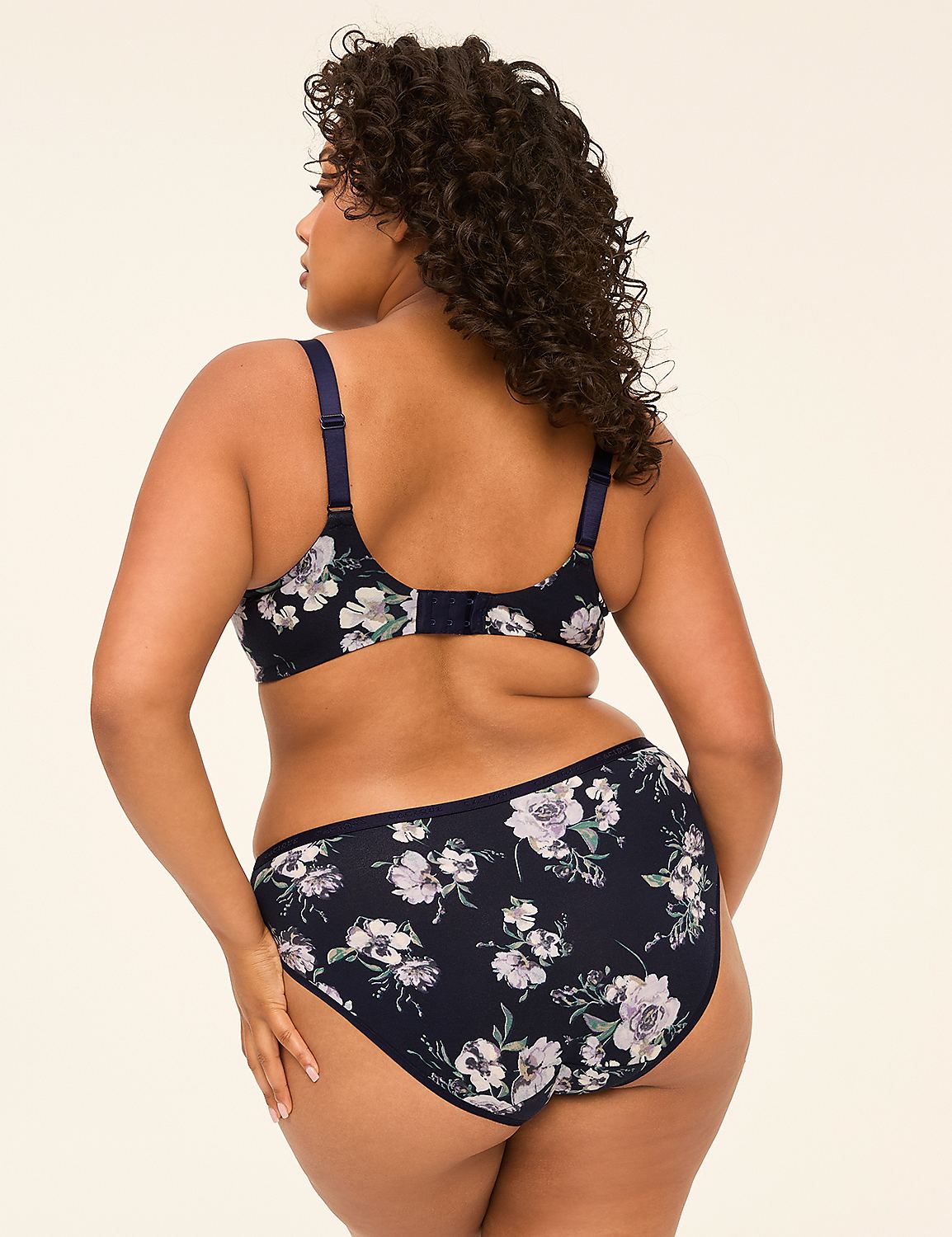 A woman in a floral bra and matching underwear stands against a plain, light-colored background. Product Image 2